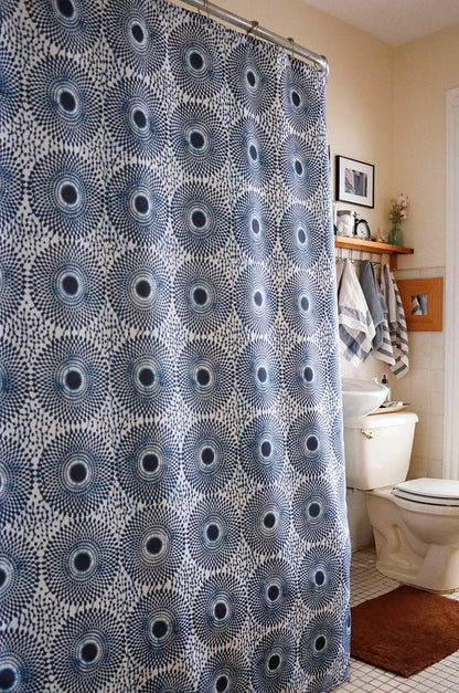 African wax print shower curtain in black and white, modern bathroom. Global homes and eclectic interior design in Brooklyn, Washington, DC, San Francisco.
