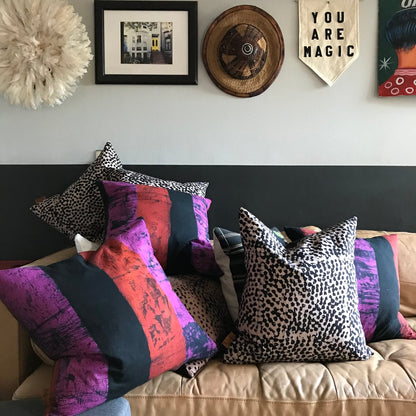 Fair Trade batik textile home goods for modern Boho home, pillows made in Ghana in partership with Osei-Duro. African home decor and textiles in modern home with African art and juju hat.