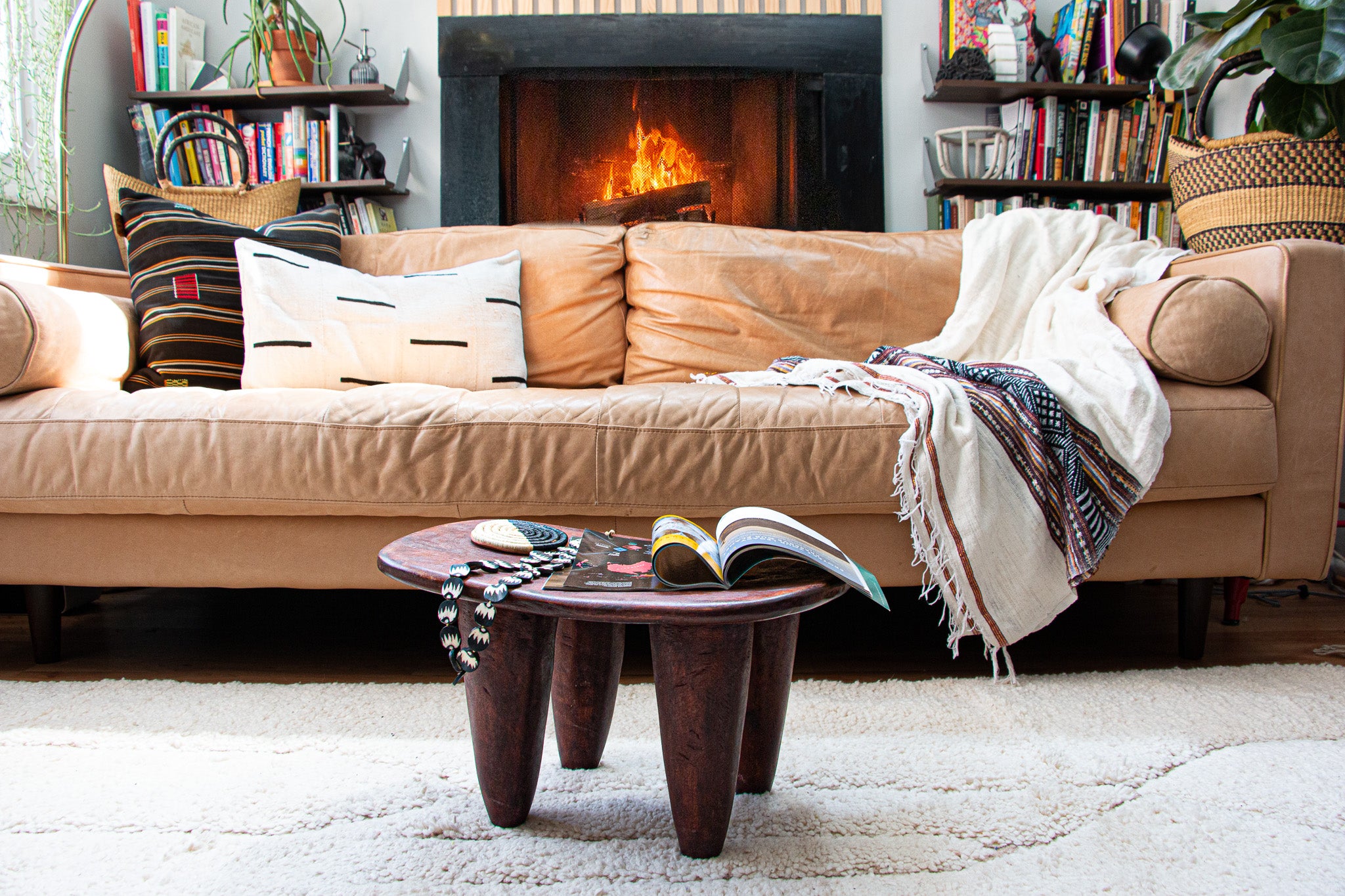 Interior design and modern living room with Moroccan rug and other African accents.