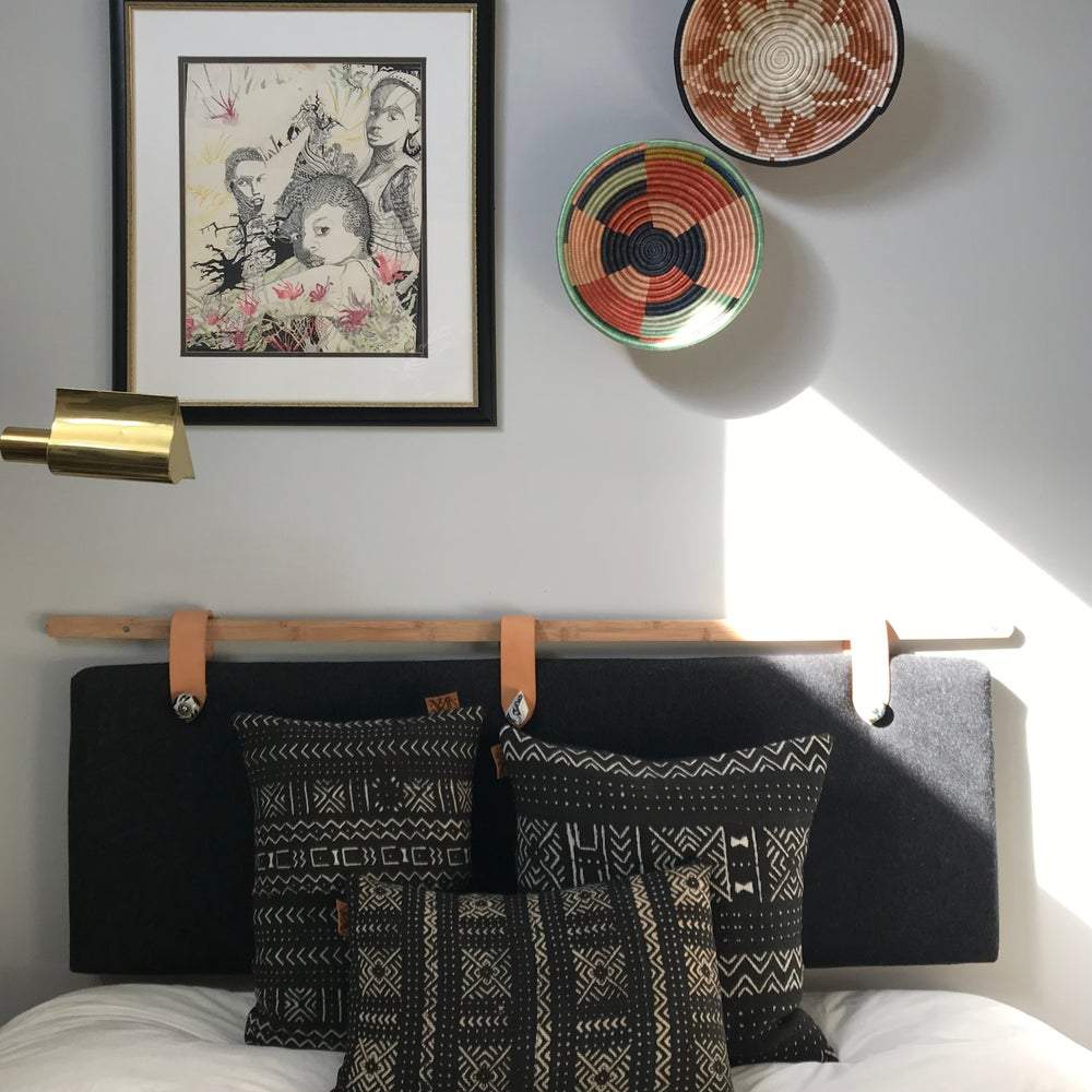 Mudcloth pillows in black and white, modern bedroom. Global homes and eclectic interior design in Brooklyn, Washington, DC, San Francisco.