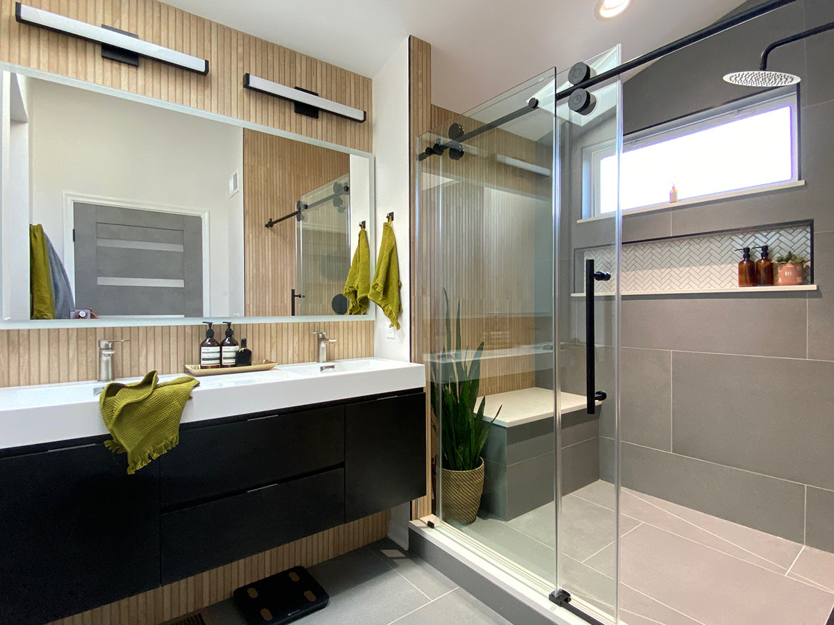 Luxury minimalist bathroom design featuring floating countertop and slate flooring in a large single family home.