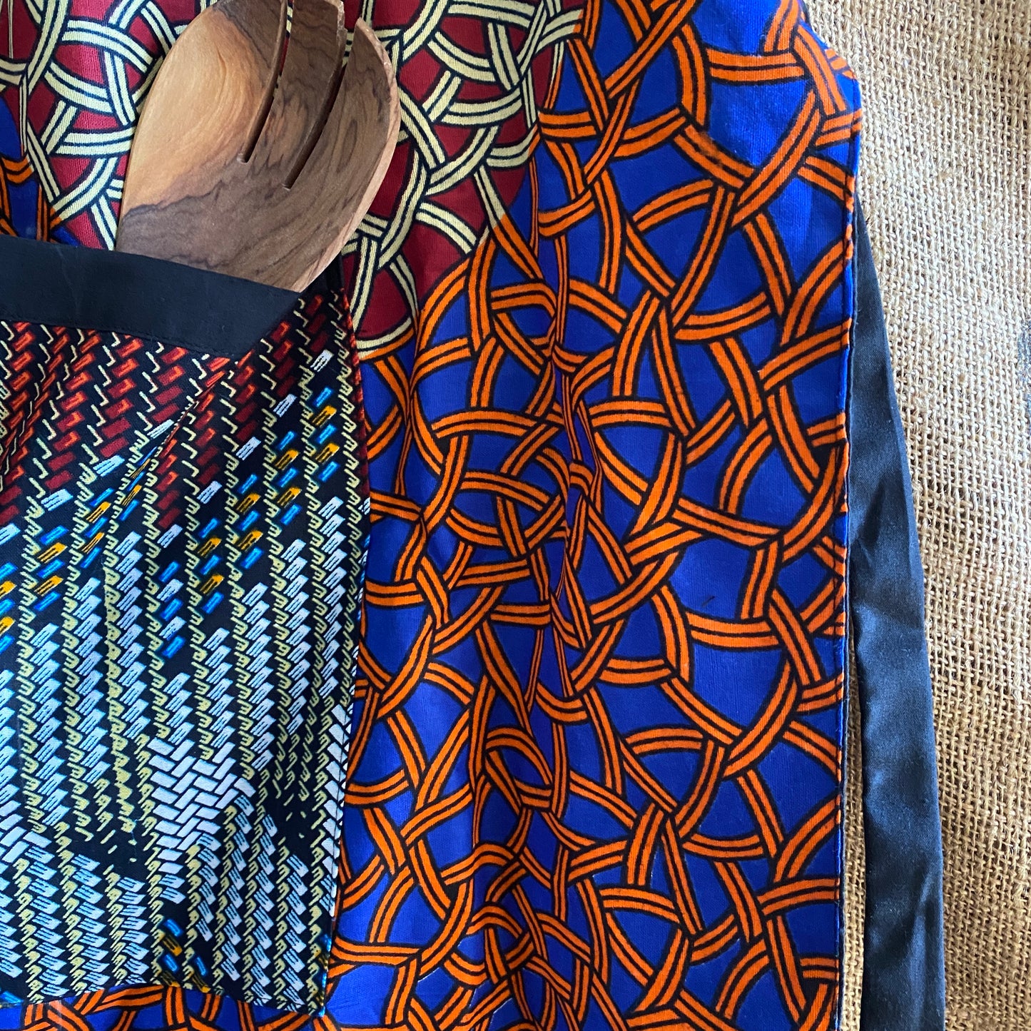 Detail of Handcrafted African wax print apron made in Uganda. Perfect for housewarming and wedding gitfs. Excellent for entertaining guests during the holidays, Thankgiving, Christmas, and more.