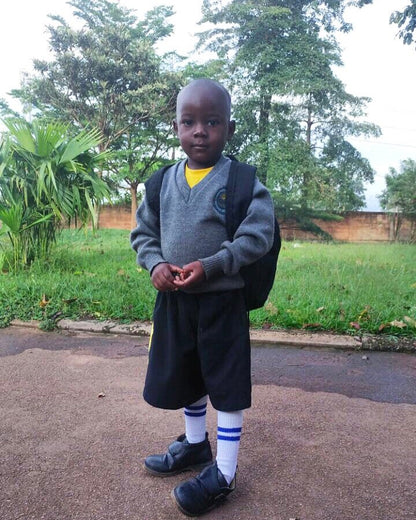 Our social impact work benefits the children of Mukono, Uganda. Obo is one of our primary education scholarship recipients.