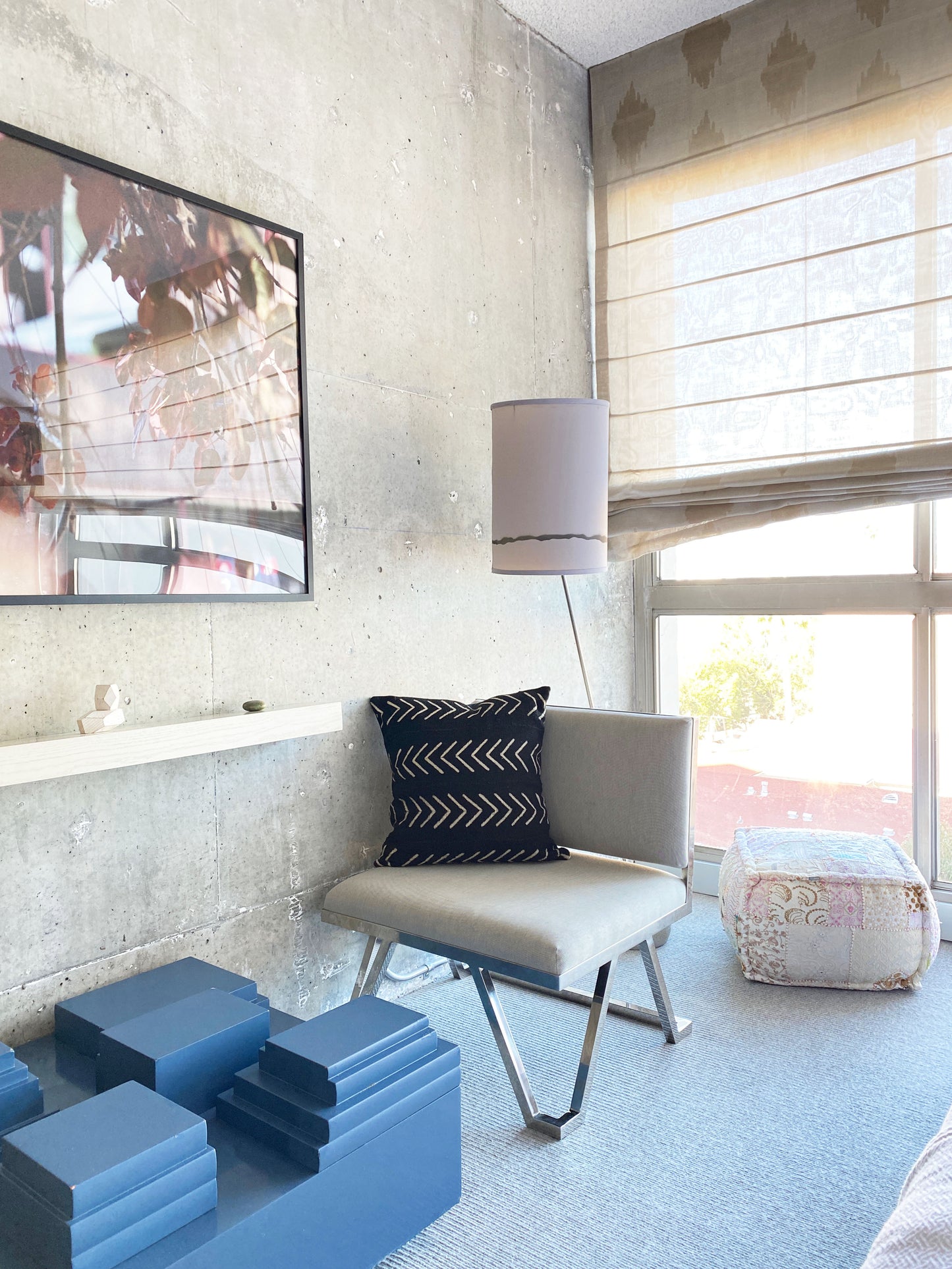 Black mudcloth pillows with minimalist designs styled with African art and modern furniture. Modern pillows made in USA, designed in Mali. Seen here in modern Los Angeles loft apartment, boutique hotel..