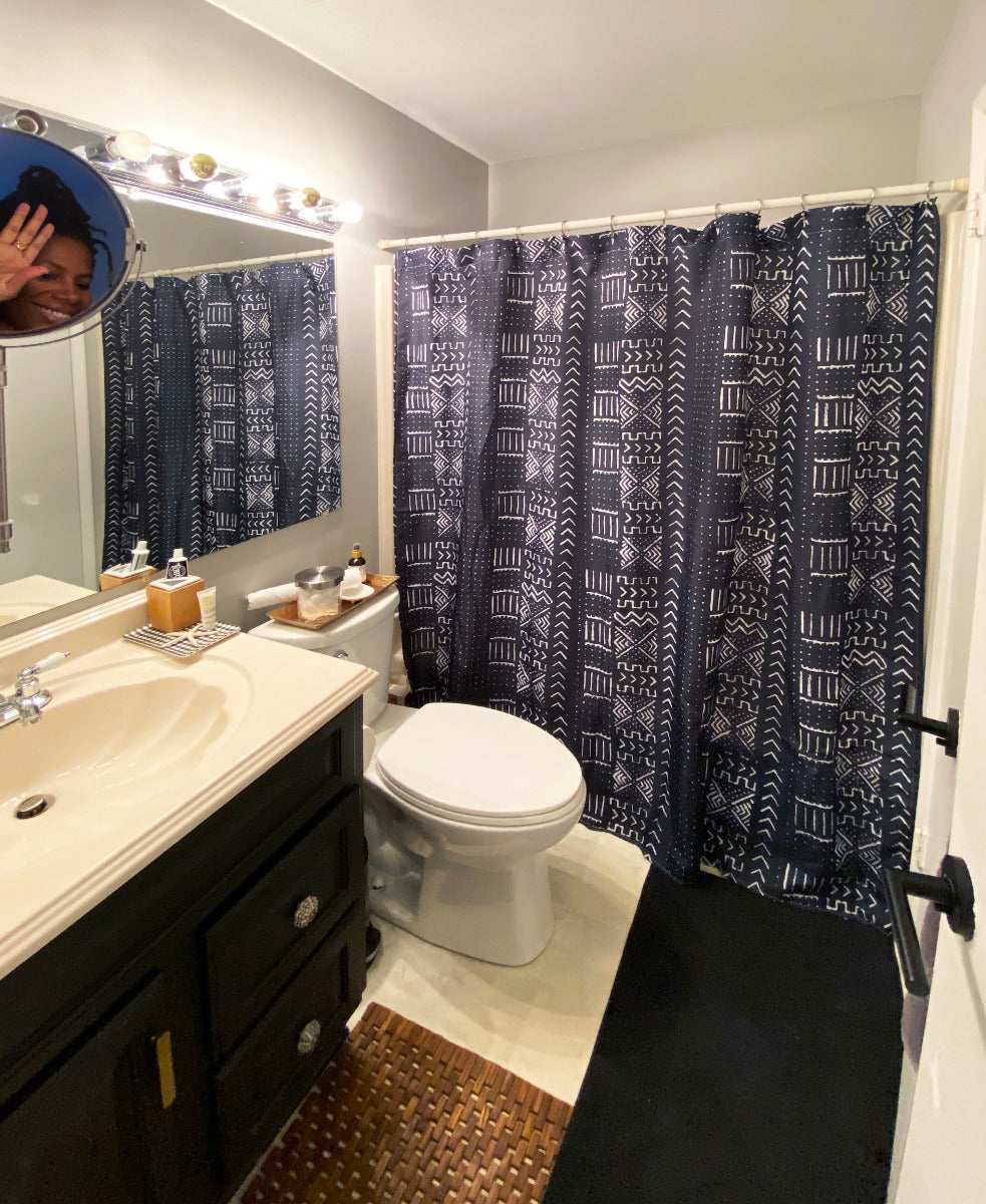 Mudcloth shower curtain in black and white, modern bathroom. Global homes and eclectic interior design in Brooklyn, Washington, DC, San Francisco.