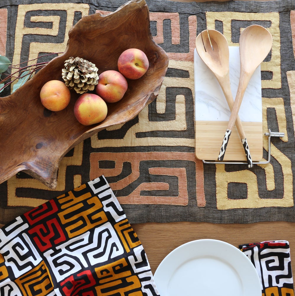 Fair Trade home goods made in Uganda, Sustainable African salad servers for housewarming and wedding registry gifts. Handcarved acacia wood and bone on kuba cloth table runner.