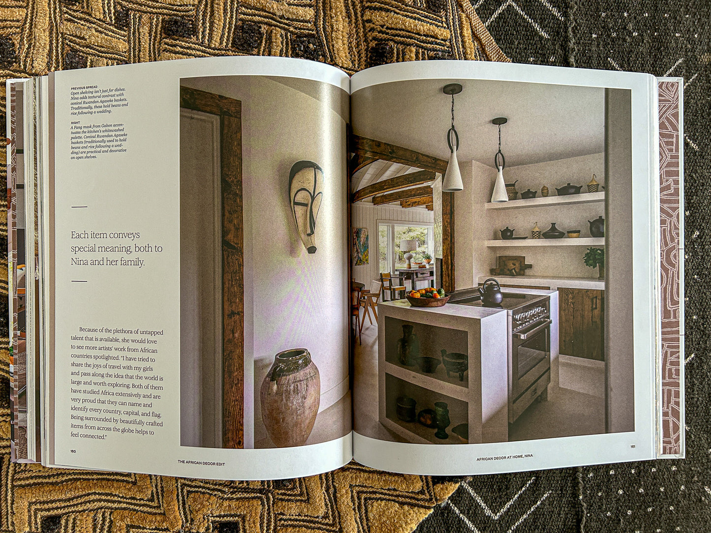 Minimalist island kitchen with African decor